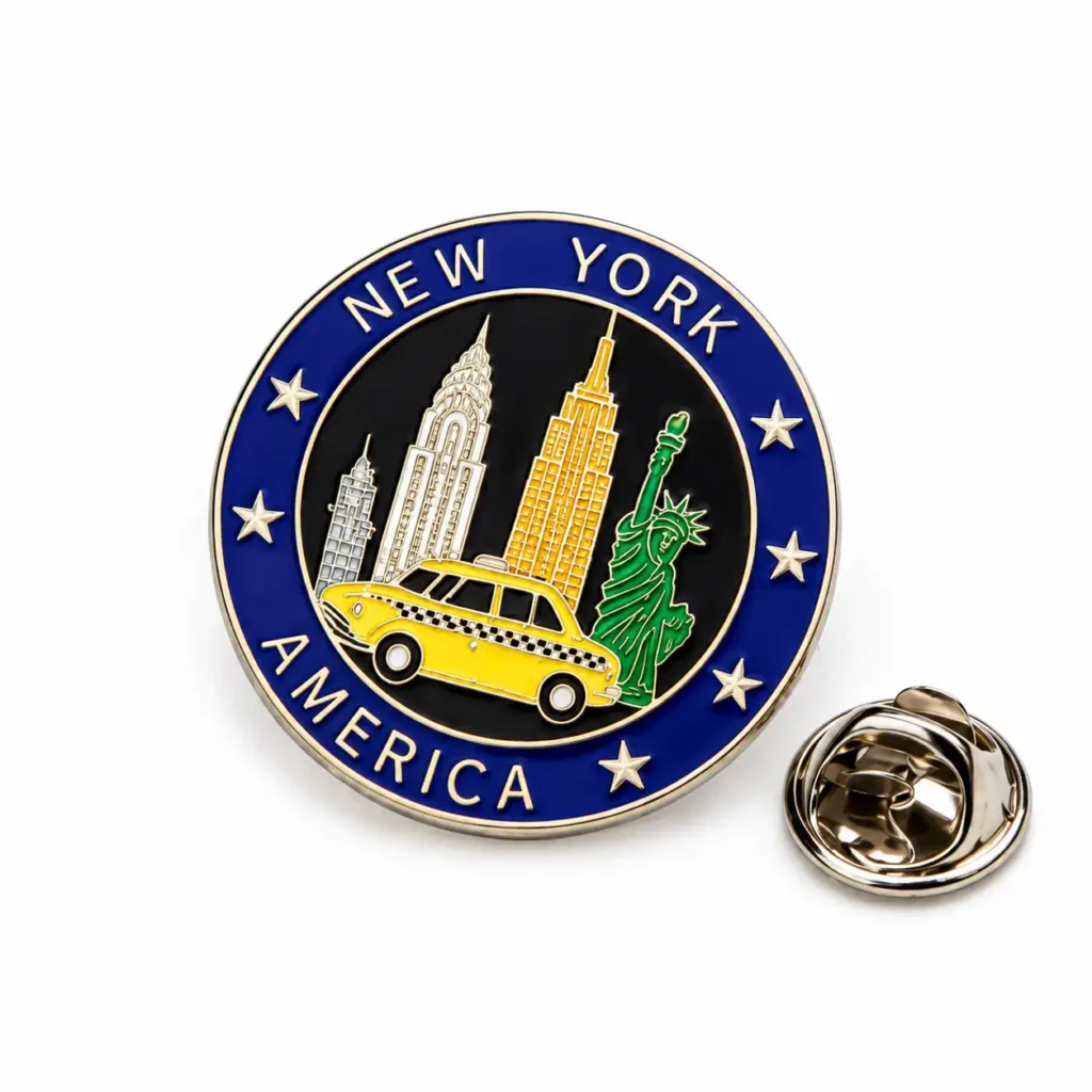 Round New York America enamel pin with skyline, Statue of Liberty, yellow taxi and silver-tone butterfly clasp