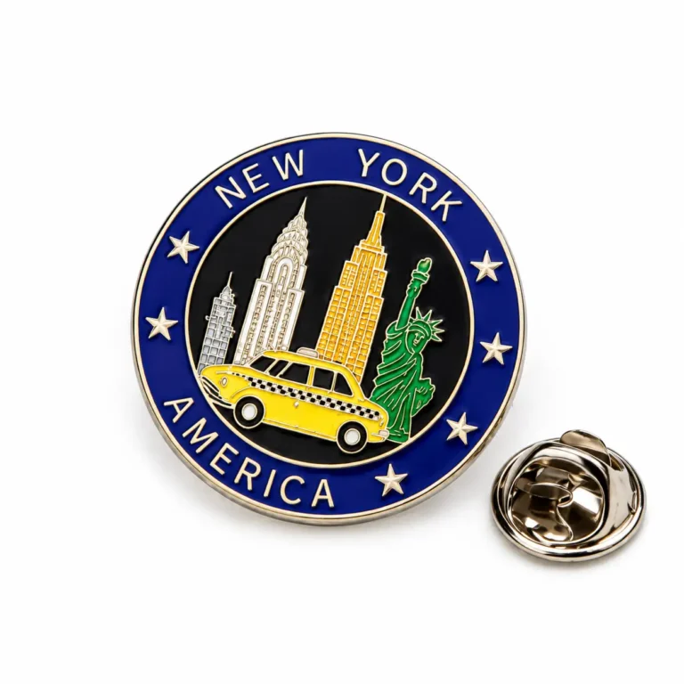 Round New York America enamel pin with skyline, Statue of Liberty, yellow taxi and silver-tone butterfly clasp