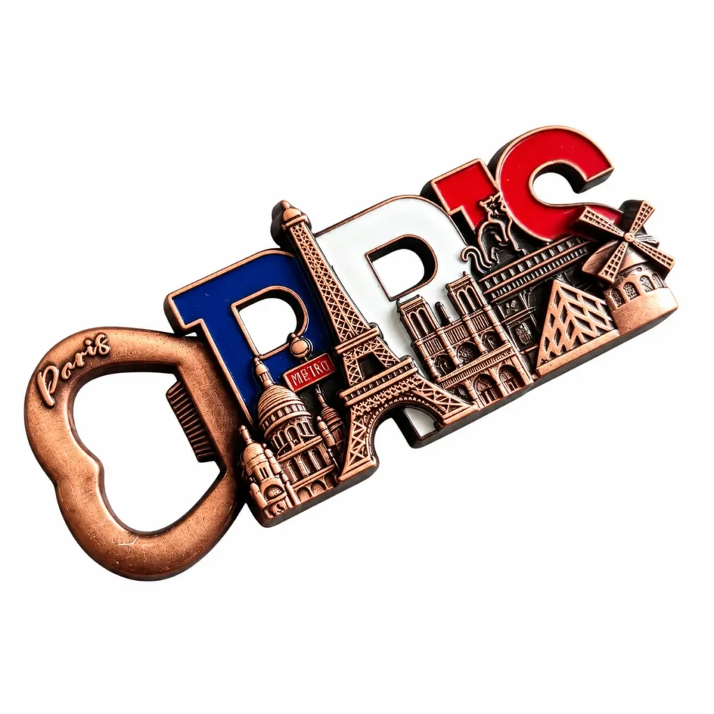 with Eiffel Tower and Landmark Details Copper-tone Paris bottle opener with blue, white and red letters and Paris landmark relief on a white background